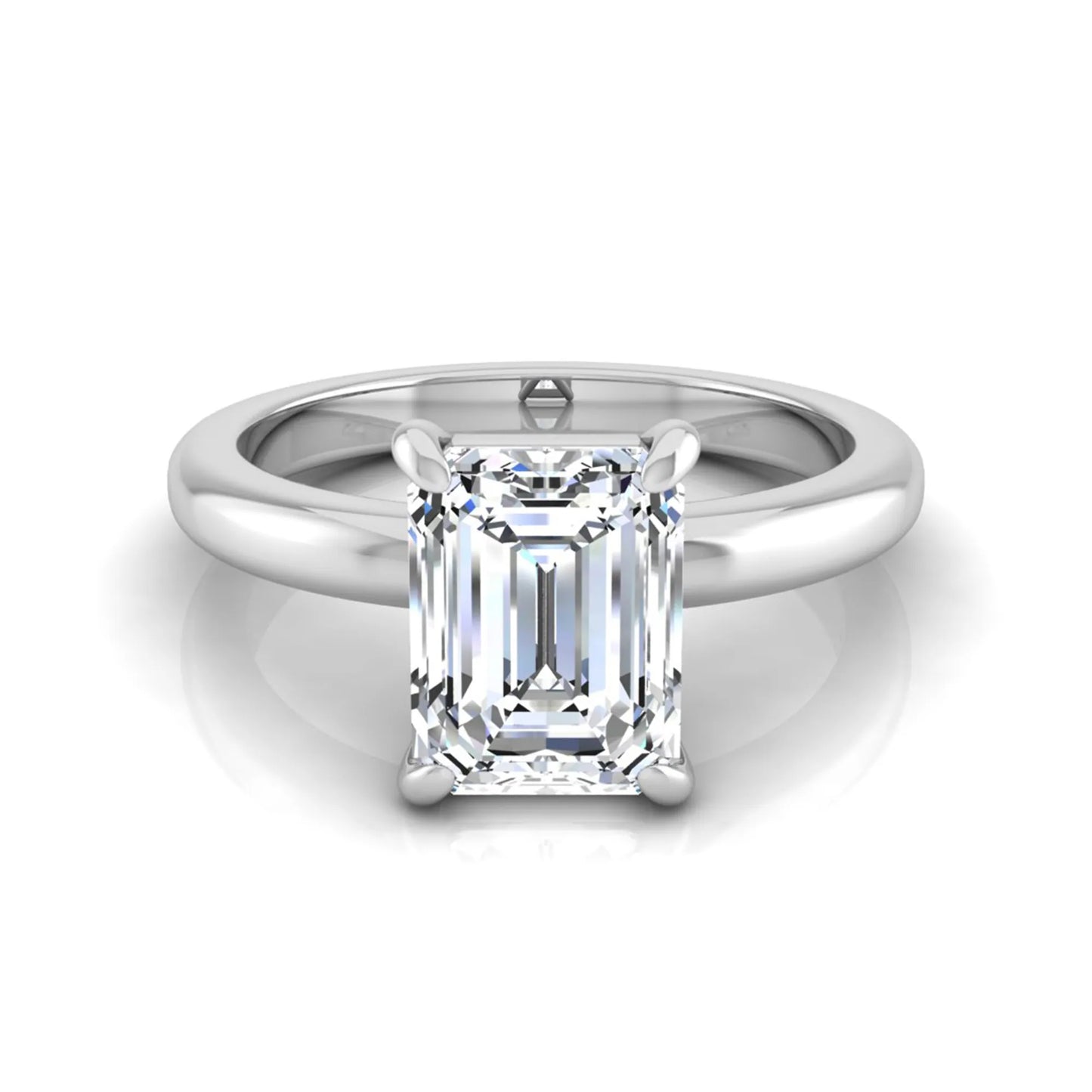 Emerald cut lab grown diamond solitaire engagement ring featuring an IGI certified center diamond in a classic four-prong setting with a polished band in white gold