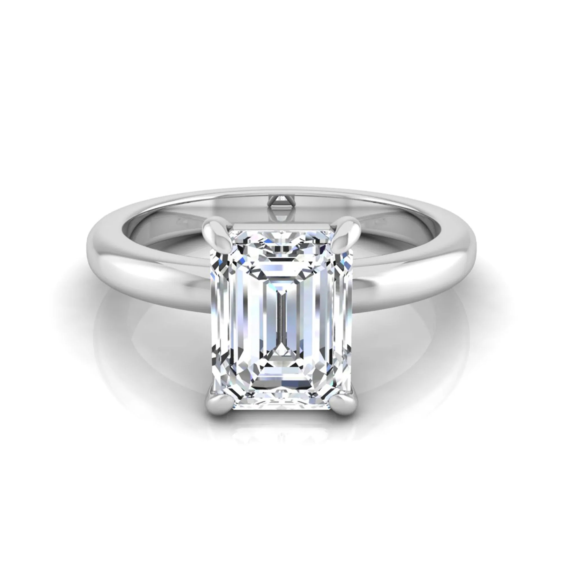 Emerald cut lab grown diamond solitaire engagement ring featuring an IGI certified center diamond in a classic four-prong setting with a polished band in white gold