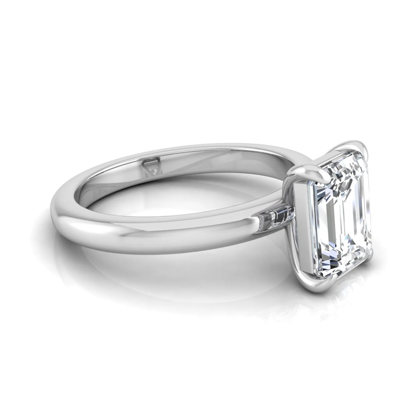 Emerald cut lab grown diamond solitaire engagement ring featuring an IGI certified center diamond in a classic four-prong setting with a polished band in white gold
