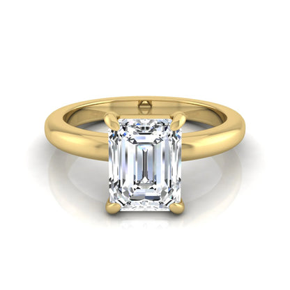 Emerald cut lab grown diamond solitaire engagement ring featuring an IGI certified center diamond in a classic four-prong setting with a polished band in yellow gold