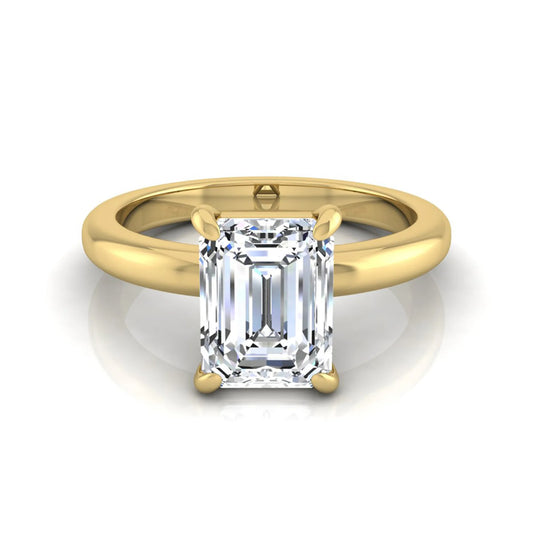 Emerald cut lab grown diamond solitaire engagement ring featuring an IGI certified center diamond in a classic four-prong setting with a polished band in yellow gold