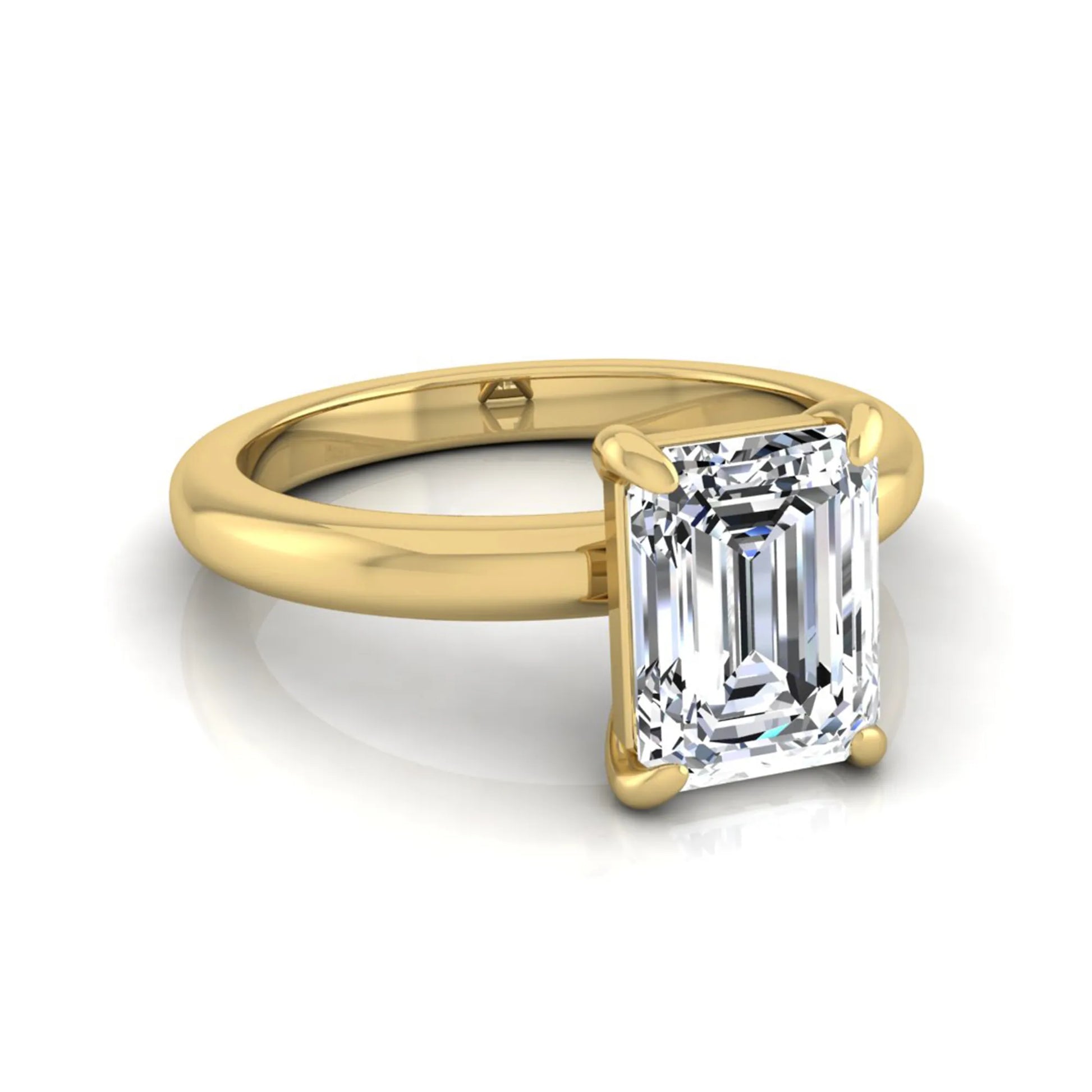 Emerald cut lab grown diamond solitaire engagement ring featuring an IGI certified center diamond in a classic four-prong setting with a polished band in yellow gold
