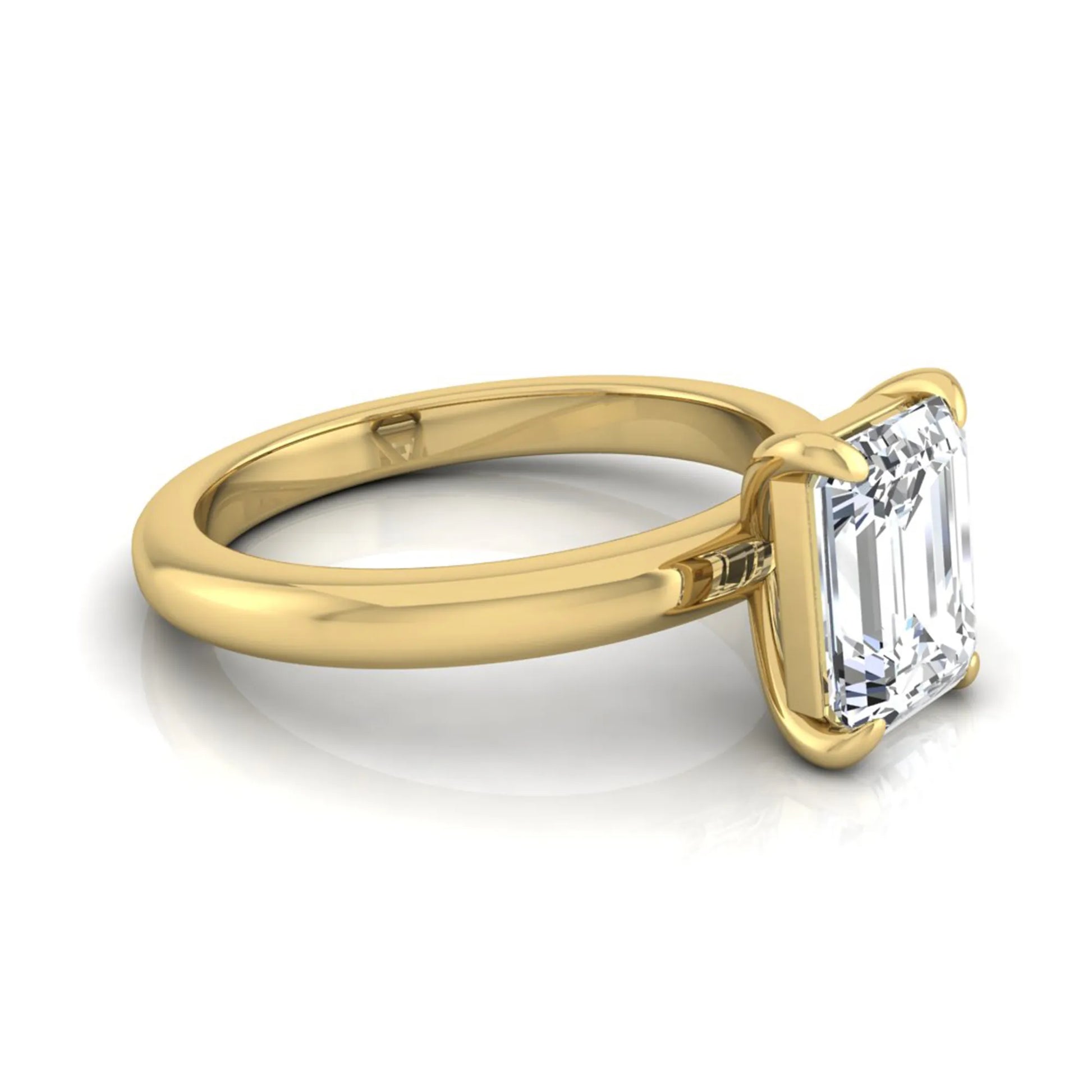 Emerald cut lab grown diamond solitaire engagement ring featuring an IGI certified center diamond in a classic four-prong setting with a polished band in yellow gold