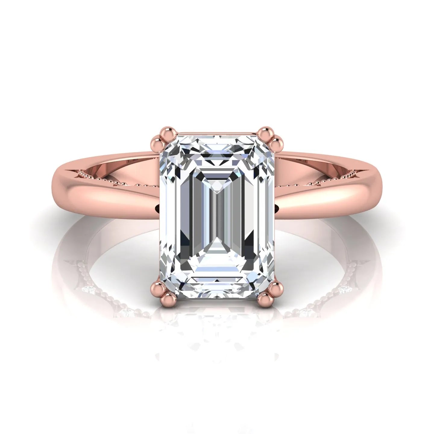 Emerald cut lab grown diamond engagement ring featuring a 3.01 carat IGI certified center diamond in a four-prong solitaire setting with hidden round diamond accents beneath the gallery and a polished rose gold band.