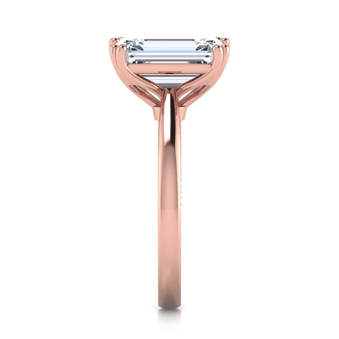 Emerald cut lab grown diamond engagement ring featuring a 3.01 carat IGI certified center diamond in a four-prong solitaire setting with hidden round diamond accents beneath the gallery and a polished rose gold band.