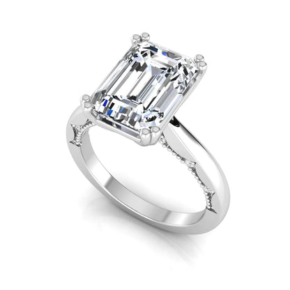 Emerald cut lab grown diamond engagement ring featuring a 3.01 carat IGI certified center diamond in a four-prong solitaire setting with hidden round diamond accents beneath the gallery and a polished white gold band.