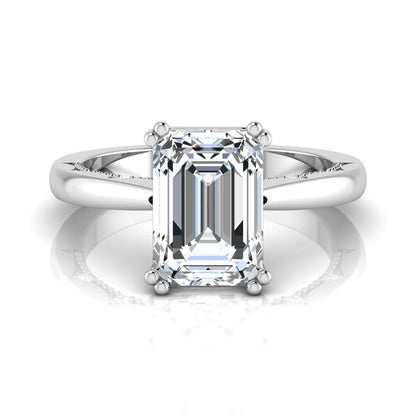 Emerald cut lab grown diamond engagement ring featuring a 3.01 carat IGI certified center diamond in a four-prong solitaire setting with hidden round diamond accents beneath the gallery and a polished white gold band.