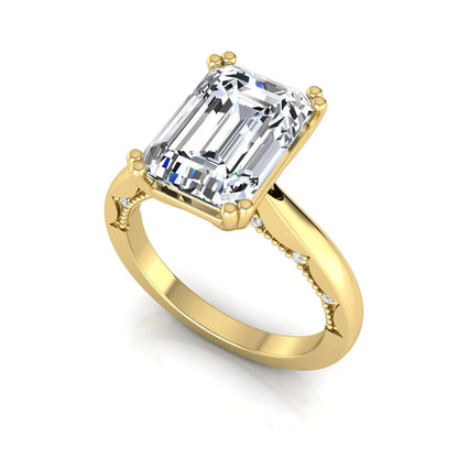 Emerald cut lab grown diamond engagement ring featuring a 3.01 carat IGI certified center diamond in a four-prong solitaire setting with hidden round diamond accents beneath the gallery and a polished yellow gold band.