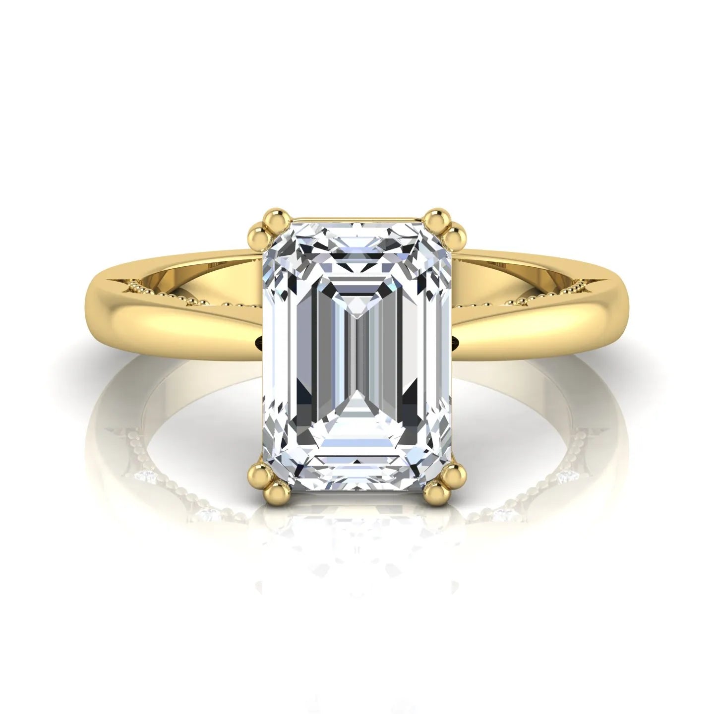 Emerald cut lab grown diamond engagement ring featuring a 3.01 carat IGI certified center diamond in a four-prong solitaire setting with hidden round diamond accents beneath the gallery and a polished yellow gold band.