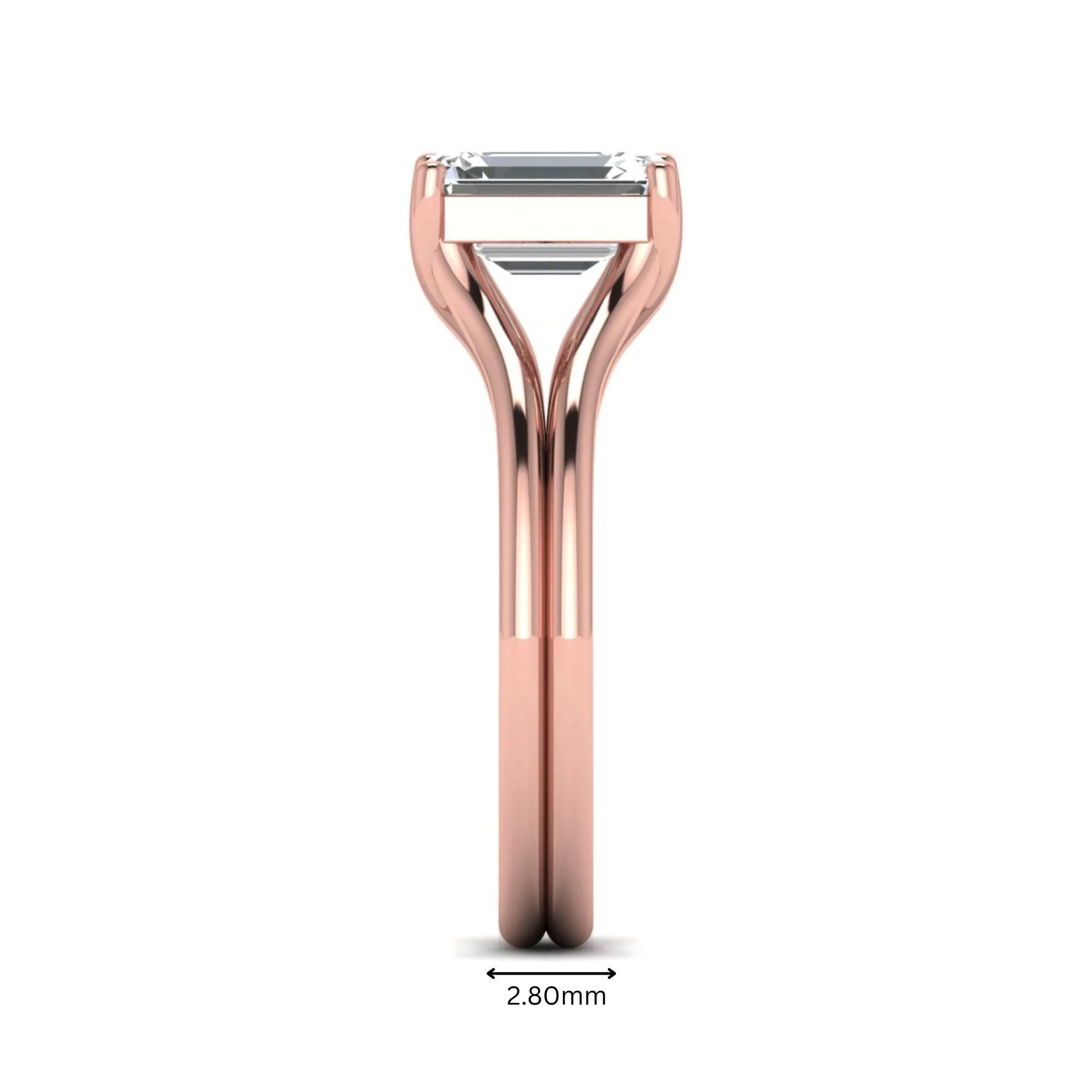 IGI certified 1.75 carat emerald cut lab grown diamond solitaire engagement ring with elegant split shank in rose gold.