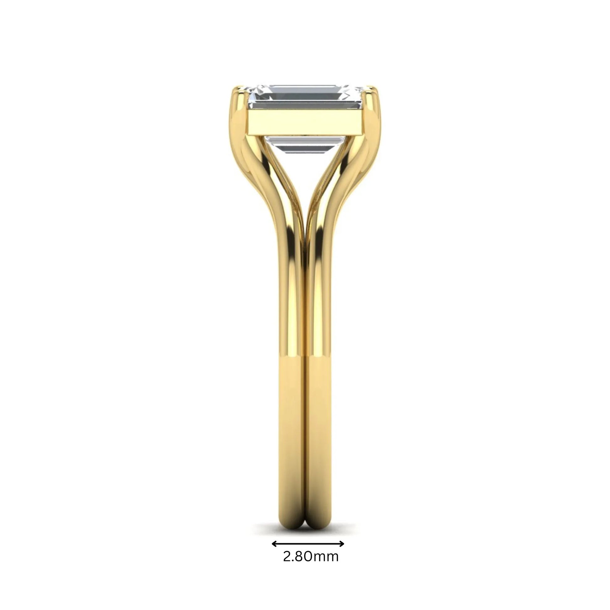 IGI certified 1.75 carat emerald cut lab grown diamond solitaire engagement ring with elegant split shank in yellow gold.