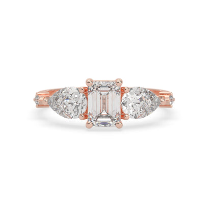 Emerald cut lab grown diamond engagement ring with pear and round diamond three stone design in rose gold