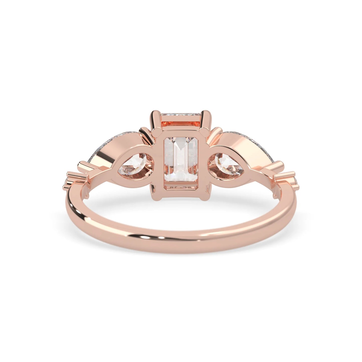 Emerald cut lab grown diamond engagement ring with pear and round diamond three stone design in rose gold
