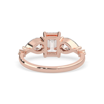 Emerald cut lab grown diamond engagement ring with pear and round diamond three stone design in rose gold