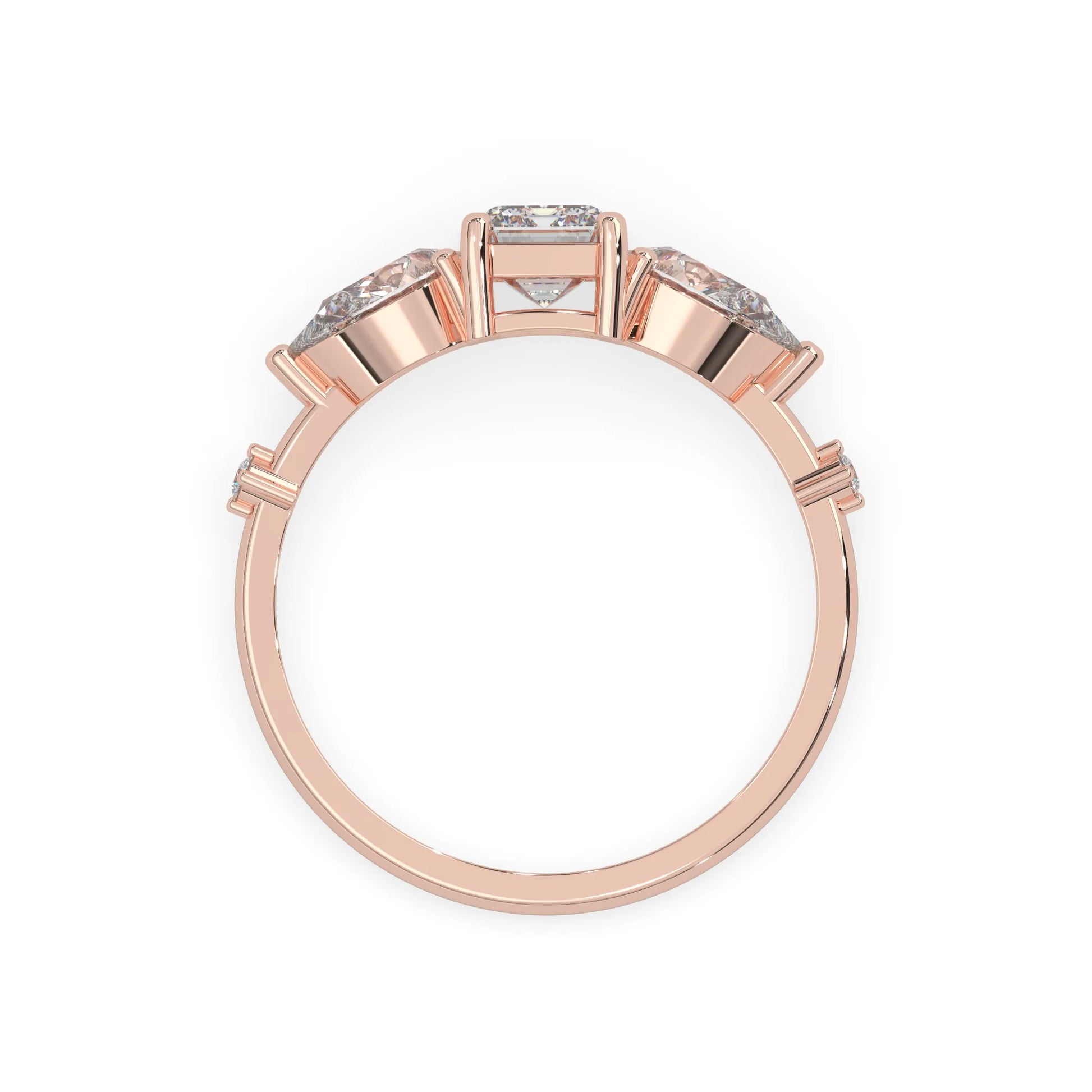 Emerald cut lab grown diamond engagement ring with pear and round diamond three stone design in rose gold