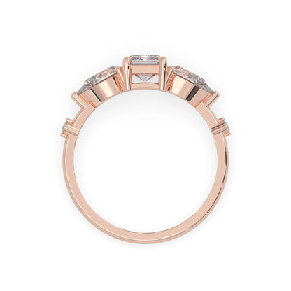 Emerald cut lab grown diamond engagement ring with pear and round diamond three stone design in rose gold