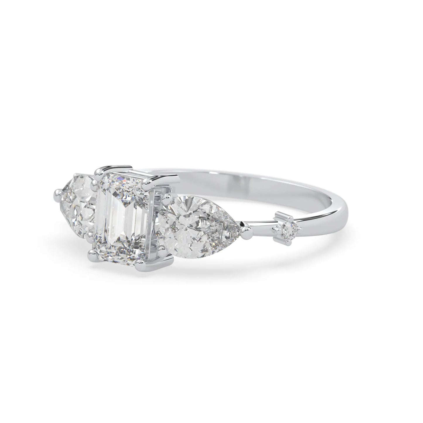 Emerald cut lab grown diamond engagement ring with pear and round diamond three stone design in white gold
