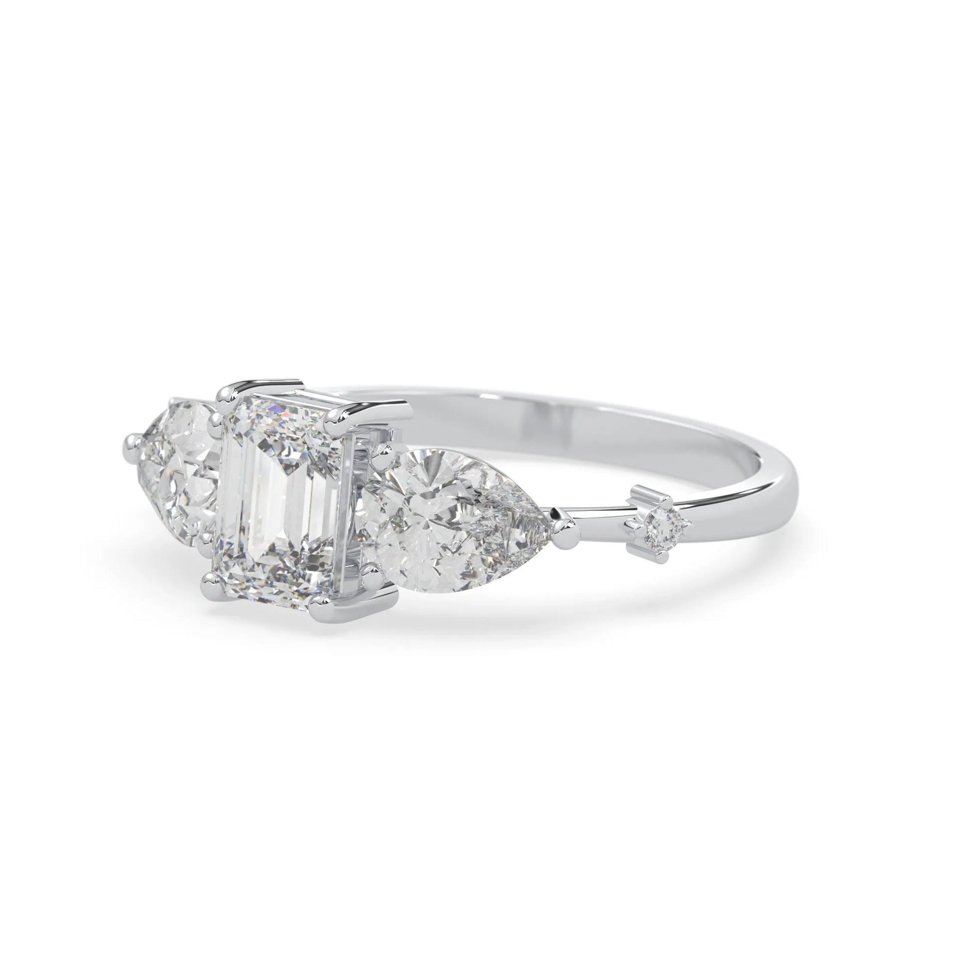 Emerald cut lab grown diamond engagement ring with pear and round diamond three stone design in white gold