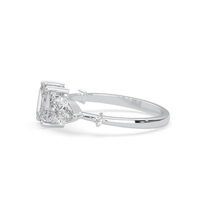 Emerald cut lab grown diamond engagement ring with pear and round diamond three stone design in white gold