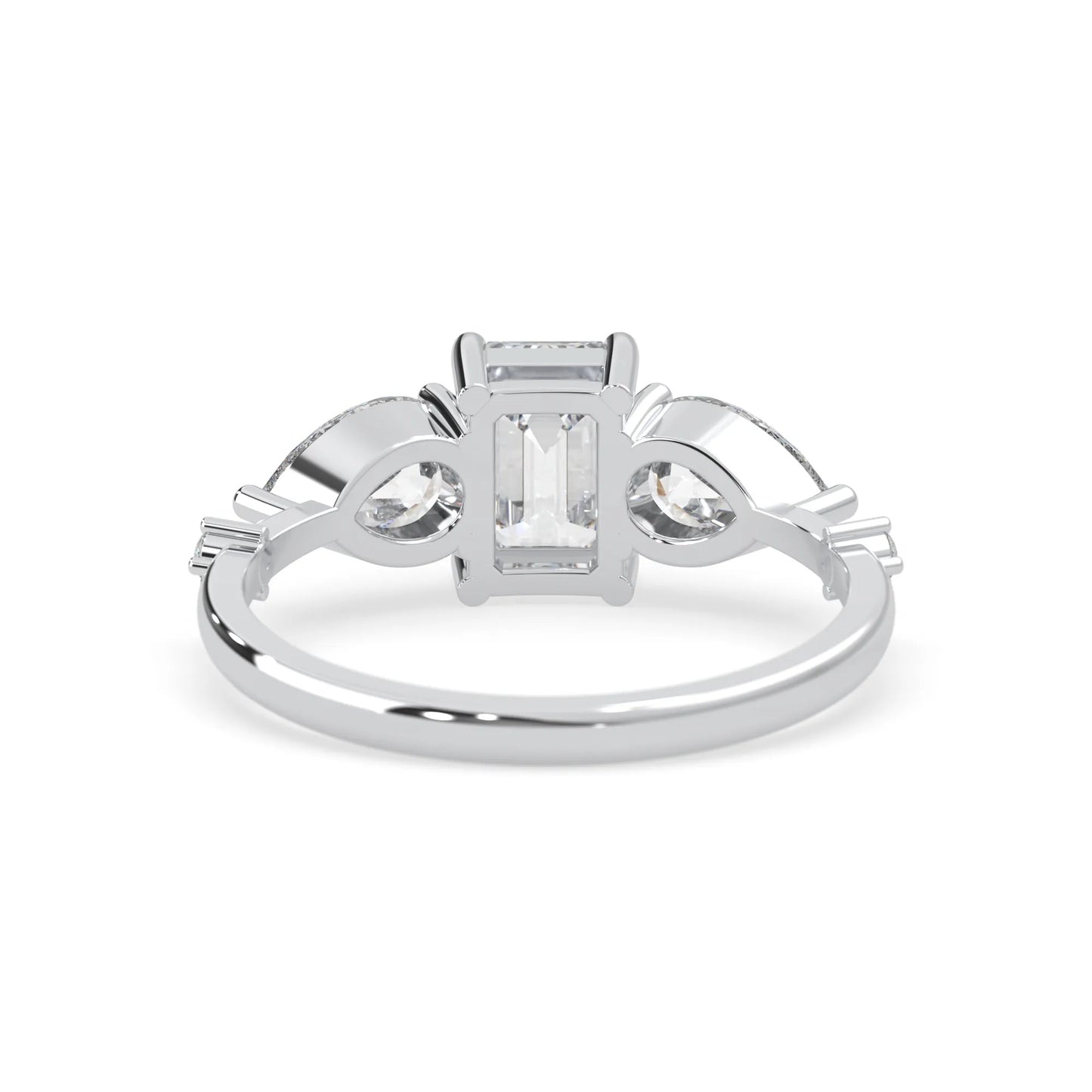 Emerald cut lab grown diamond engagement ring with pear and round diamond three stone design in white gold