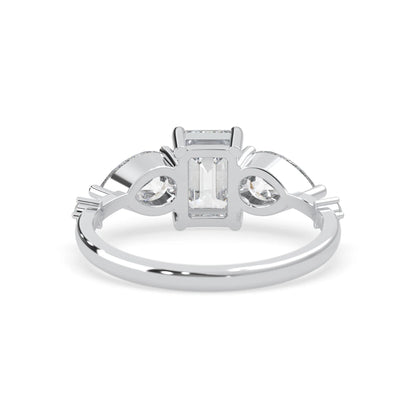 Emerald cut lab grown diamond engagement ring with pear and round diamond three stone design in white gold