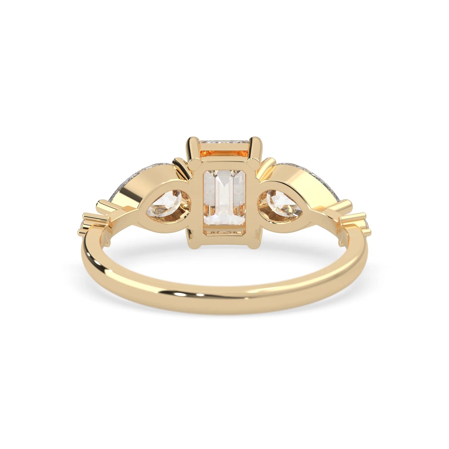 Emerald cut lab grown diamond engagement ring with pear and round diamond three stone design in yellow gold