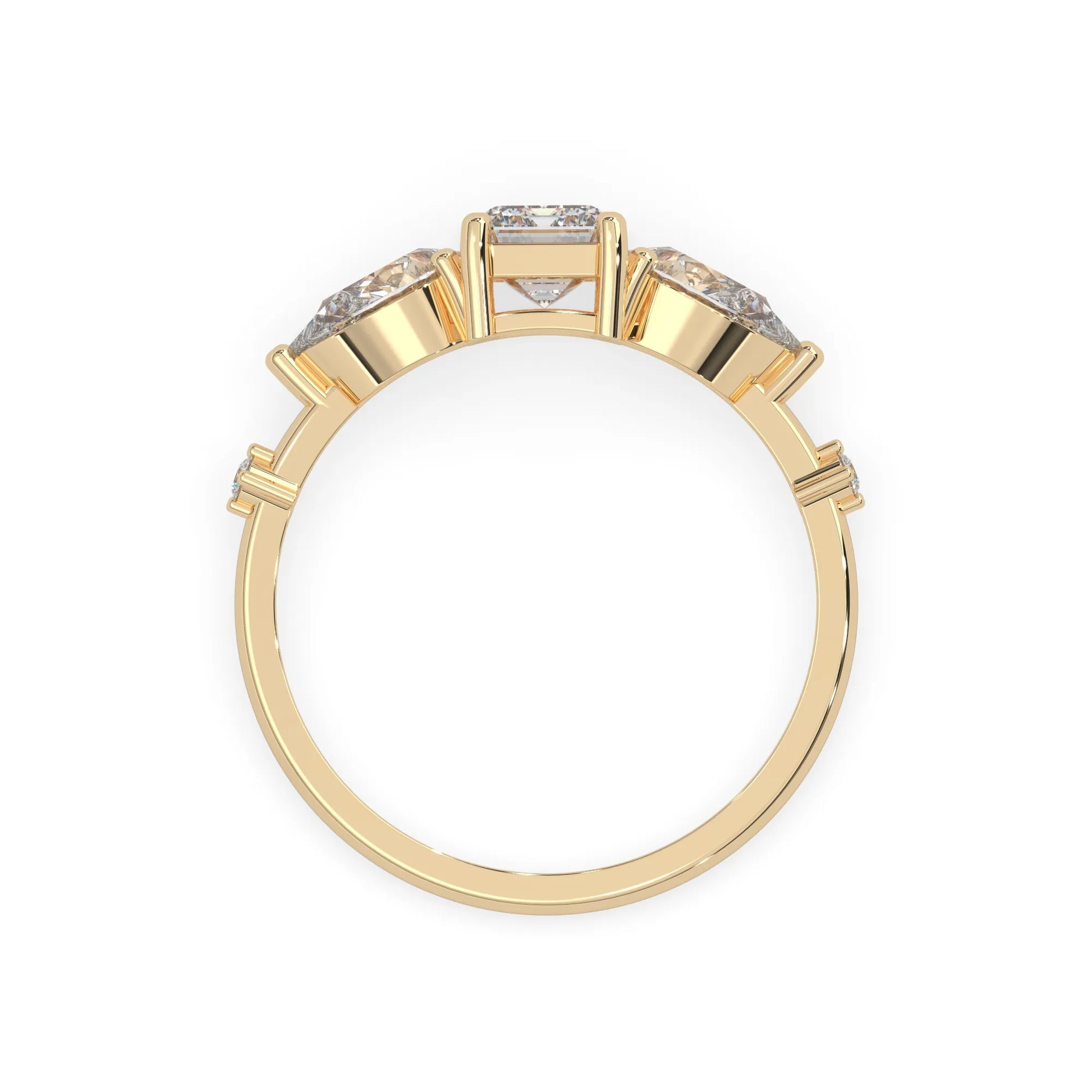 Emerald cut lab grown diamond engagement ring with pear and round diamond three stone design in yellow gold