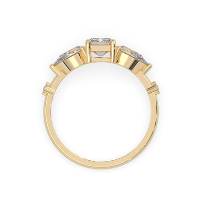 Emerald cut lab grown diamond engagement ring with pear and round diamond three stone design in yellow gold