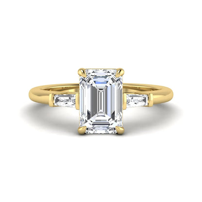 IGI Certified 2.20 carat emerald cut lab grown diamond engagement ring with tapered baguette side diamonds in yellow gold.