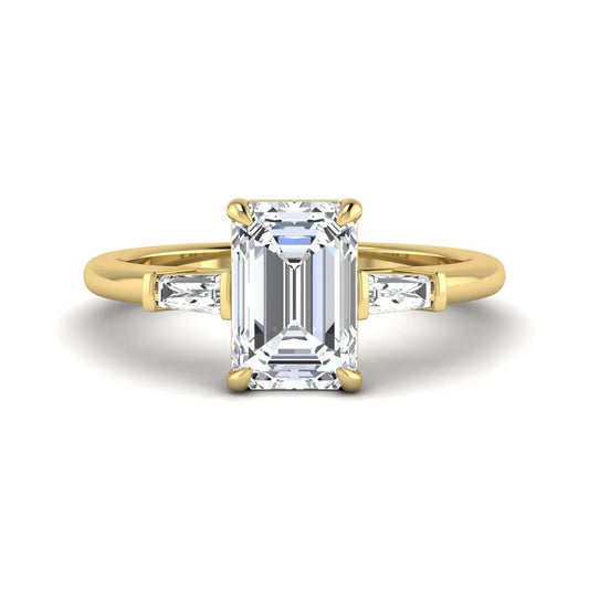 IGI Certified 2.20 carat emerald cut lab grown diamond engagement ring with tapered baguette side diamonds in yellow gold.