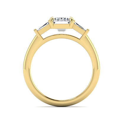IGI Certified 2.20 carat emerald cut lab grown diamond engagement ring with tapered baguette side diamonds in yellow gold.