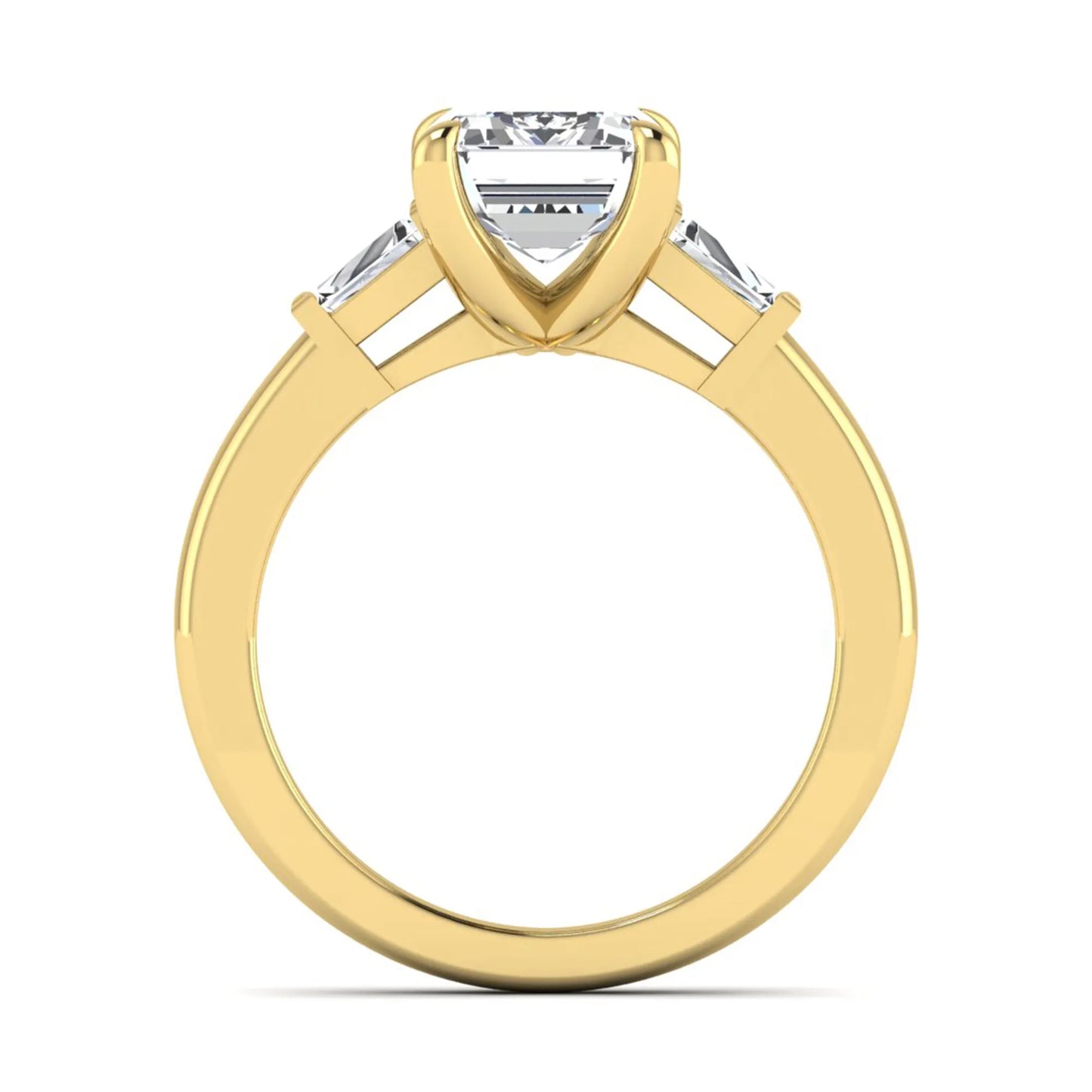 Emerald cut lab grown diamond three-stone engagement ring featuring tapered baguette side diamonds in a classic four-prong yellow gold style setting.