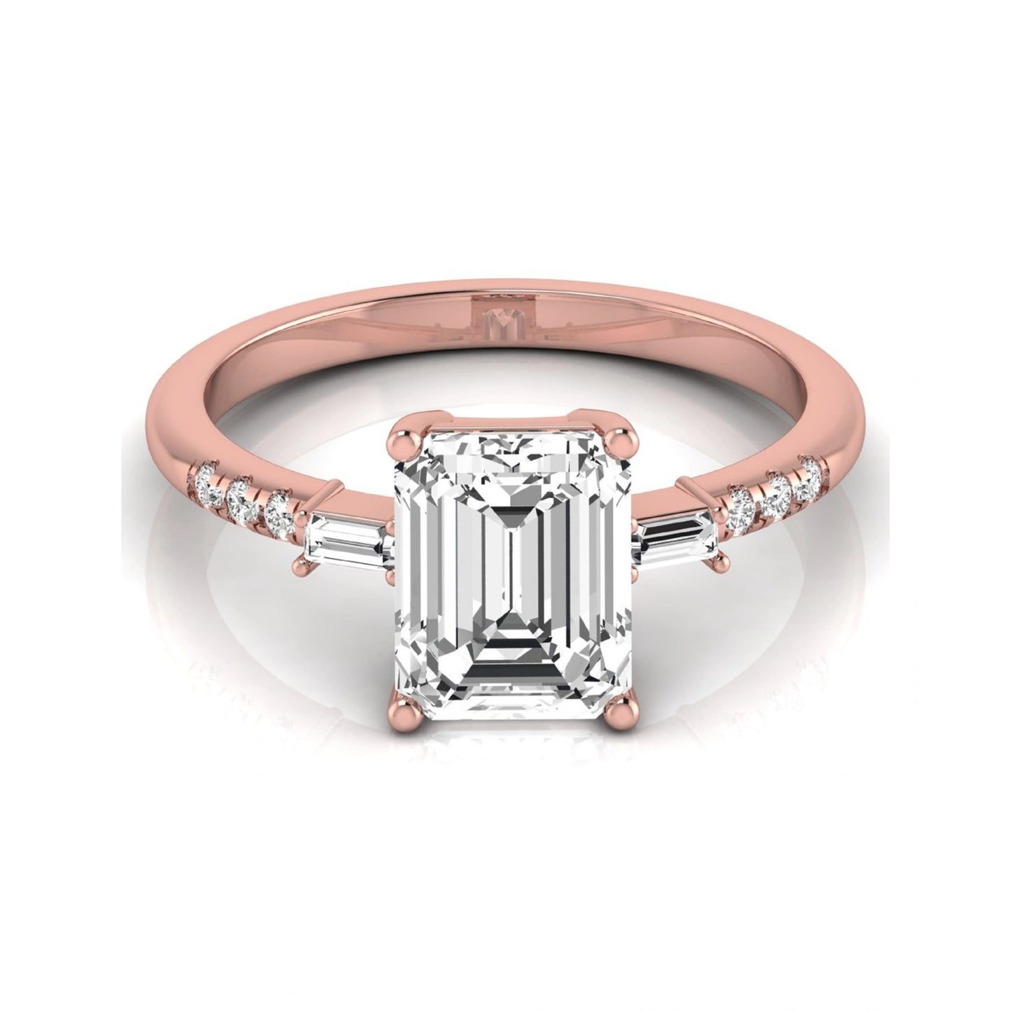 Emerald cut lab grown diamond engagement ring featuring an IGI certified center diamond with baguette and round side diamonds in a classic four-prong three-stone setting in rose gold