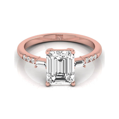 Emerald cut lab grown diamond engagement ring featuring an IGI certified center diamond with baguette and round side diamonds in a classic four-prong three-stone setting in rose gold