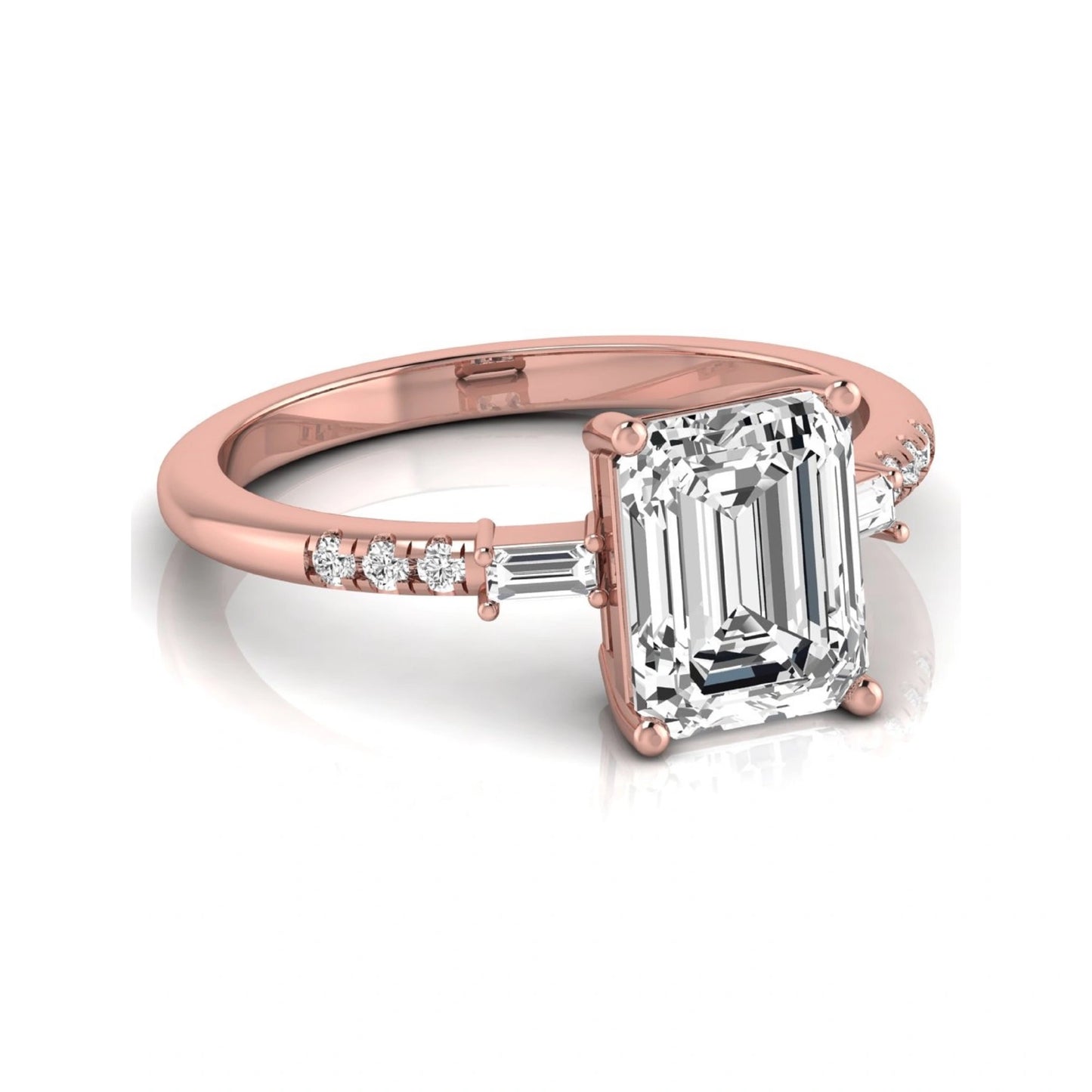 Emerald cut lab grown diamond engagement ring featuring an IGI certified center diamond with baguette and round side diamonds in a classic four-prong three-stone setting in rose gold