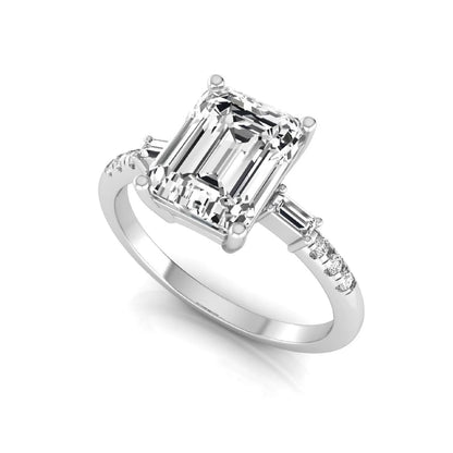 Emerald cut lab grown diamond engagement ring featuring an IGI certified center diamond with baguette and round side diamonds in a classic four-prong three-stone setting in white gold