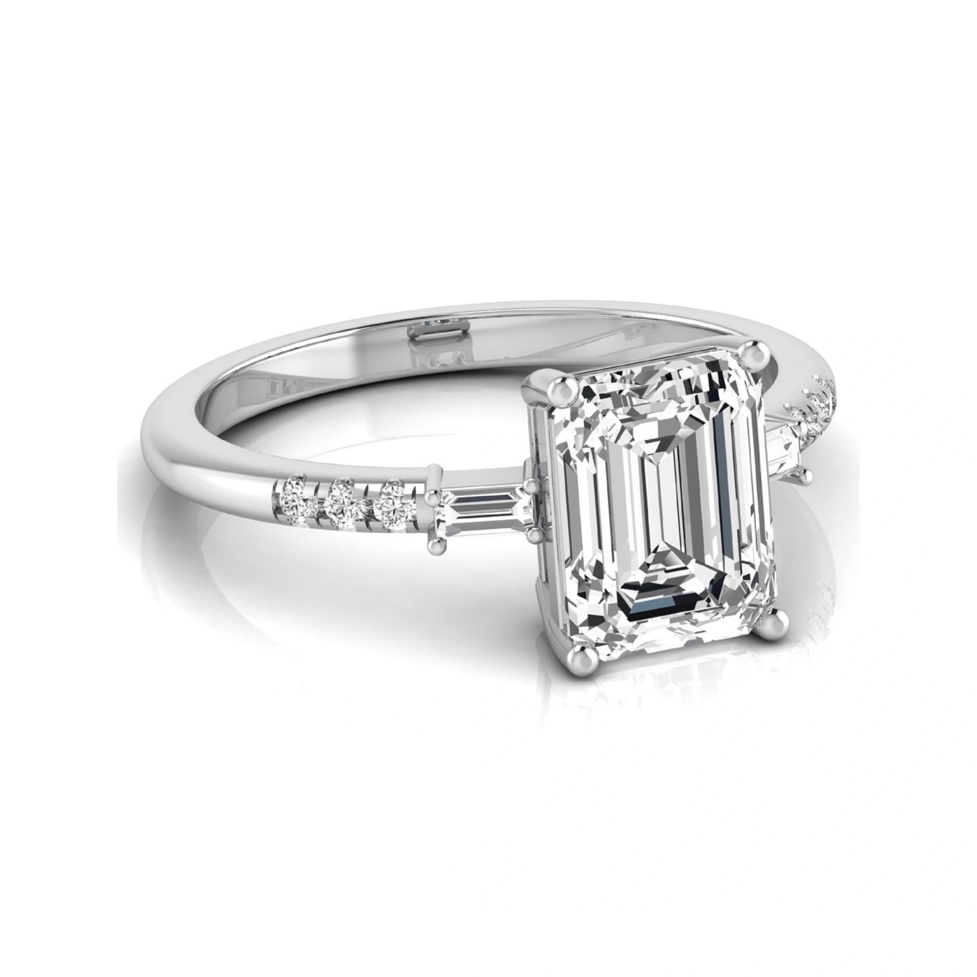Emerald cut lab grown diamond engagement ring featuring an IGI certified center diamond with baguette and round side diamonds in a classic four-prong three-stone setting in white gold