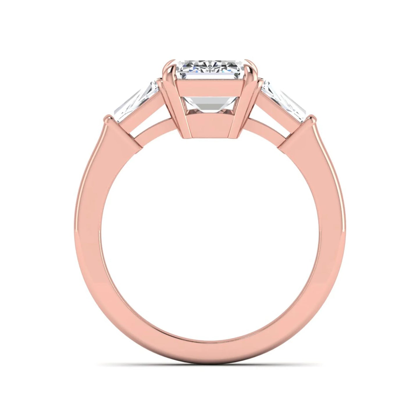Emerald three stone prong set lab grown diamond engagement ring featuring a 3.00 carat emerald cut center diamond with tapered baguette side diamonds in rose gold finish.