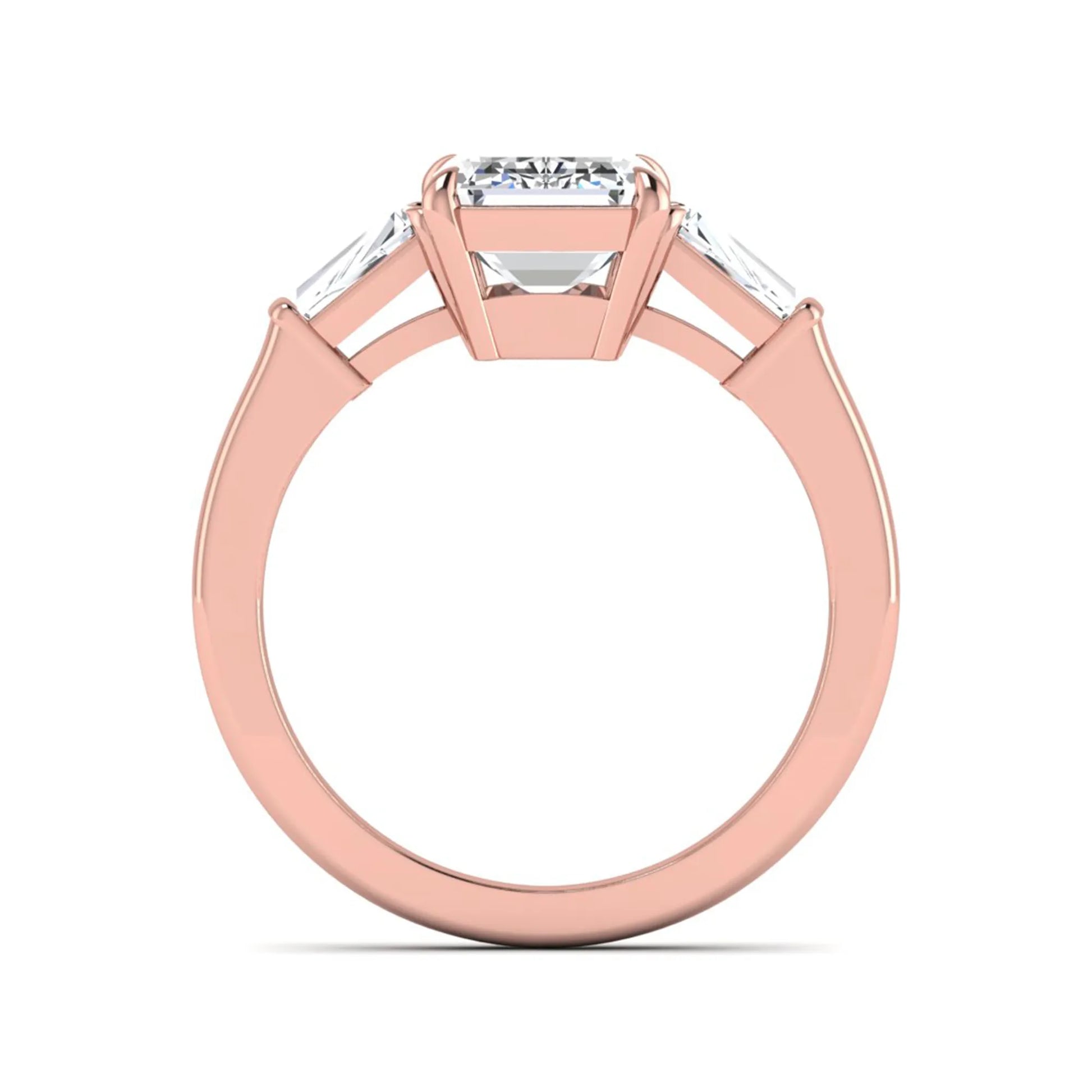 Emerald three stone prong set lab grown diamond engagement ring featuring a 3.00 carat emerald cut center diamond with tapered baguette side diamonds in rose gold finish.