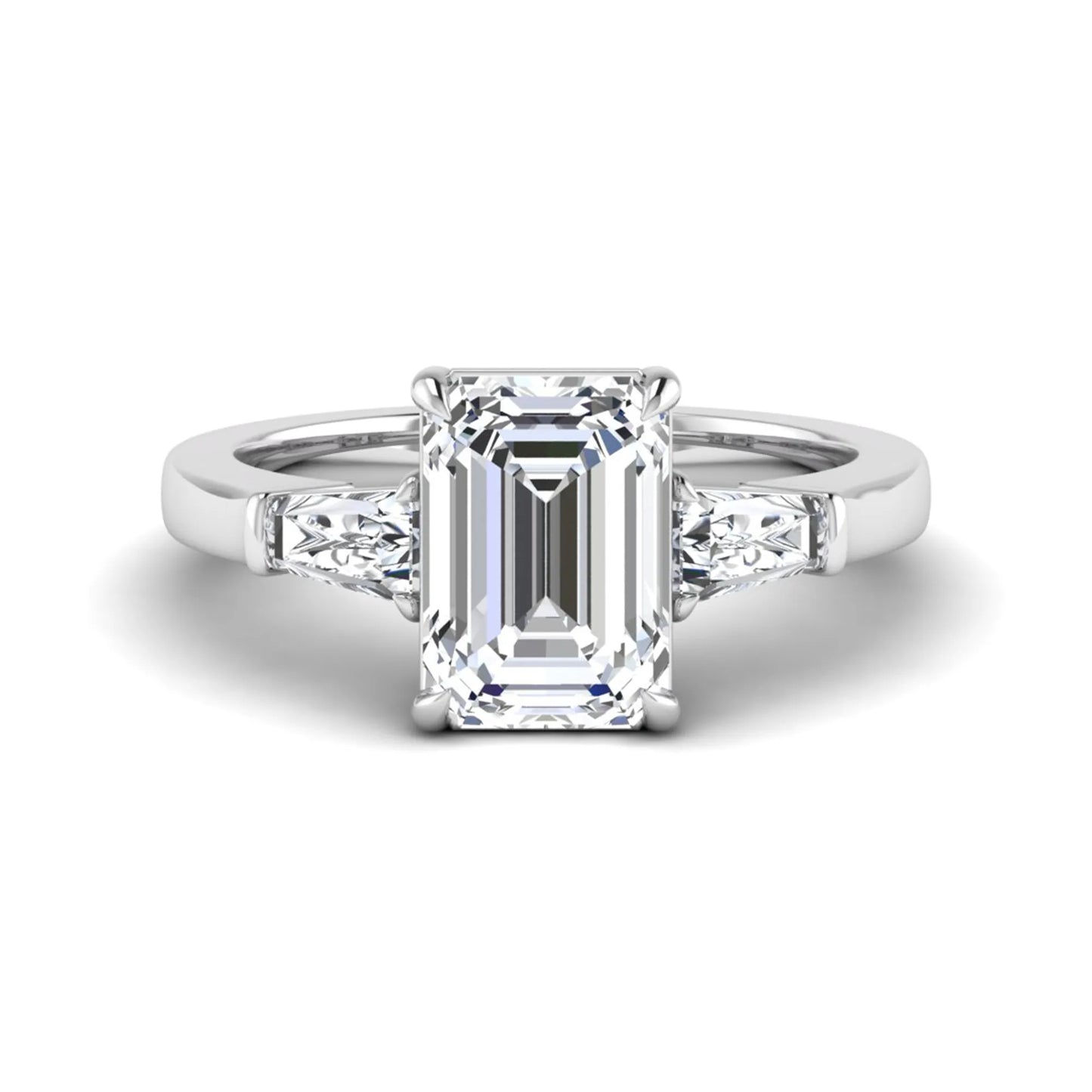 Emerald three stone prong set lab grown diamond engagement ring featuring a 3.00 carat emerald cut center diamond with tapered baguette side diamonds in white gold finish.