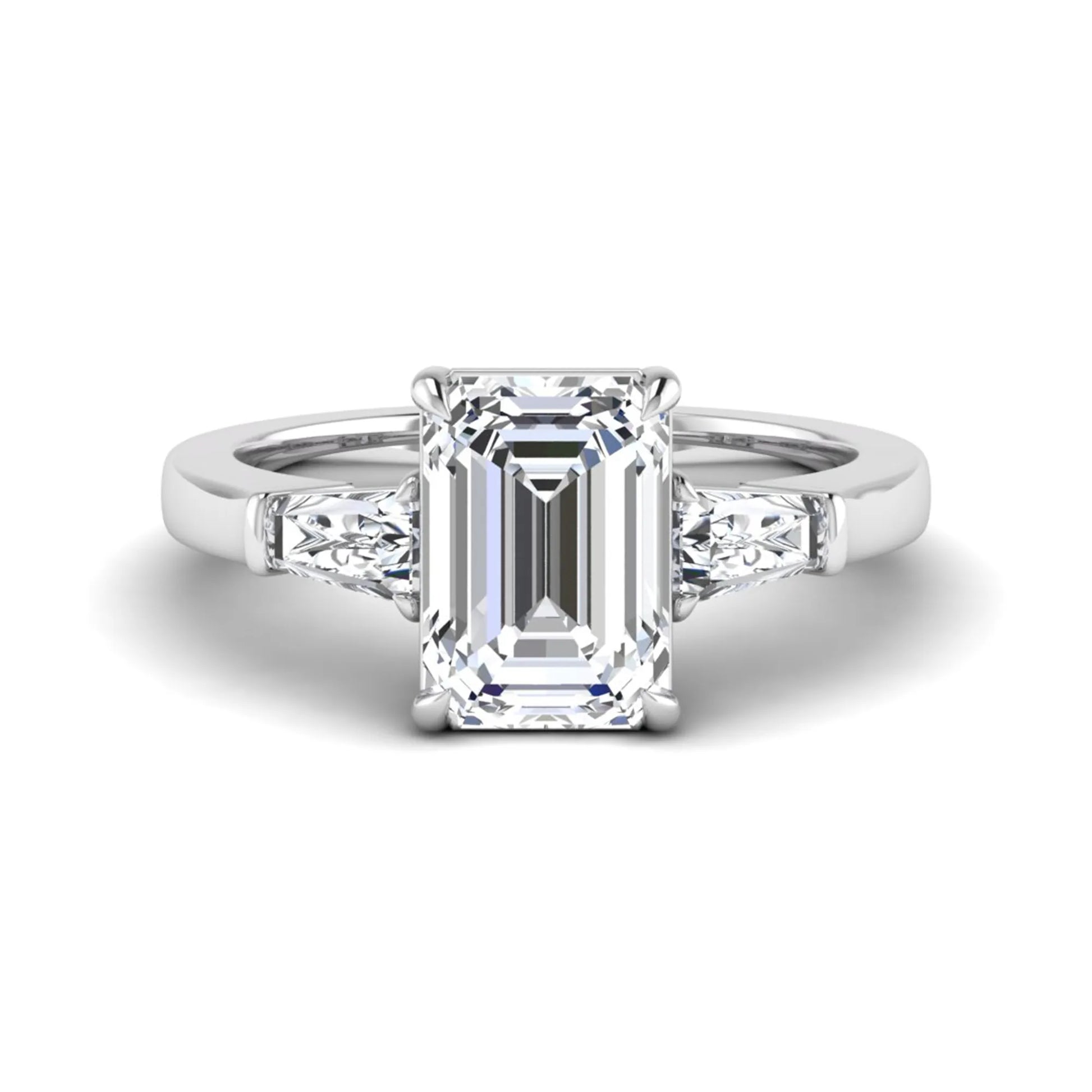 Emerald three stone prong set lab grown diamond engagement ring featuring a 3.00 carat emerald cut center diamond with tapered baguette side diamonds in white gold finish.