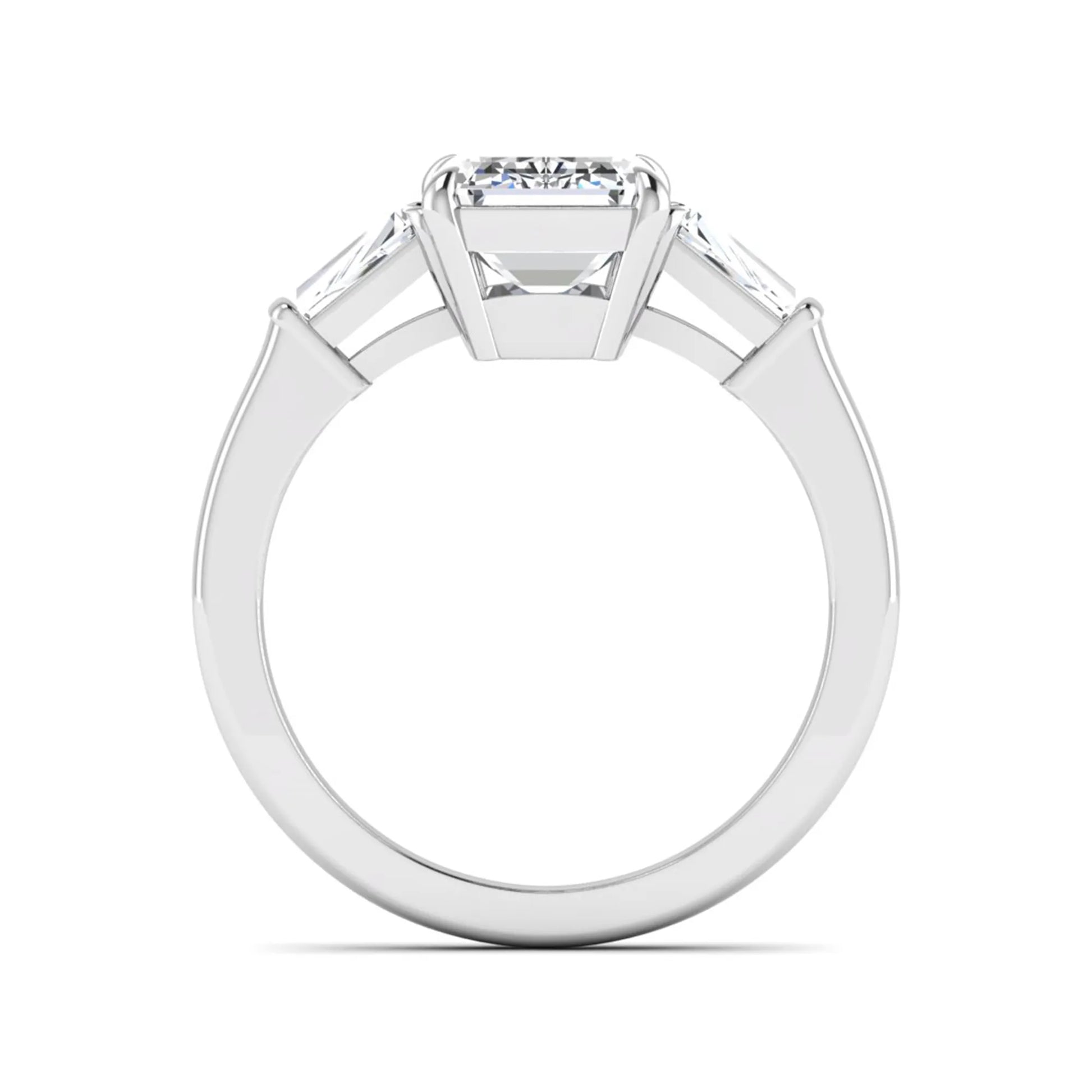 Emerald three stone prong set lab grown diamond engagement ring featuring a 3.00 carat emerald cut center diamond with tapered baguette side diamonds in white gold finish.