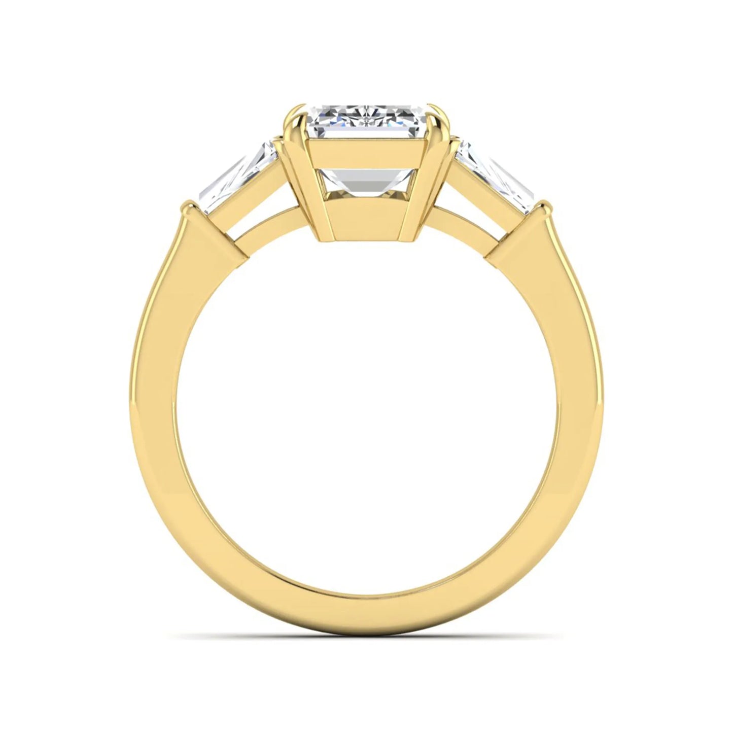 Emerald three stone prong set lab grown diamond engagement ring featuring a 3.00 carat emerald cut center diamond with tapered baguette side diamonds in yellow gold finish.