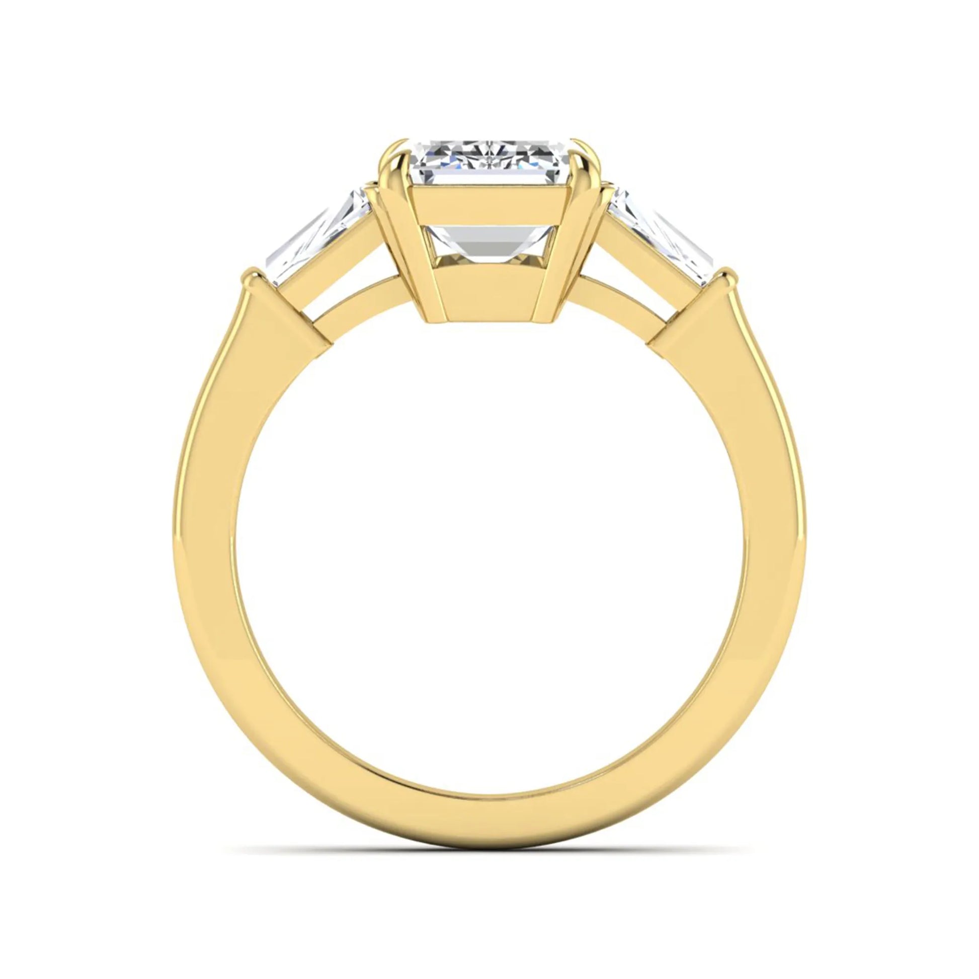 Emerald three stone prong set lab grown diamond engagement ring featuring a 3.00 carat emerald cut center diamond with tapered baguette side diamonds in yellow gold finish.
