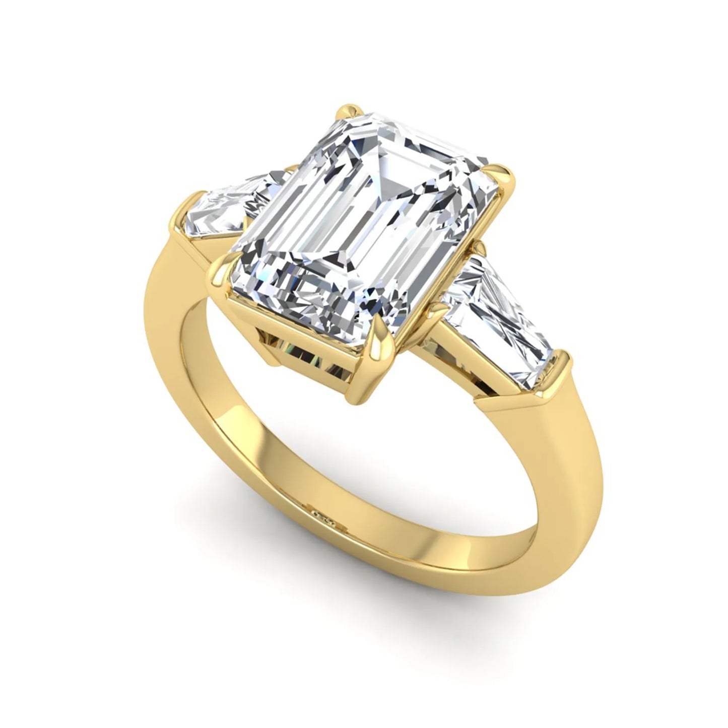 Emerald three stone prong set lab grown diamond engagement ring featuring a 3.00 carat emerald cut center diamond with tapered baguette side diamonds in yellow gold finish.