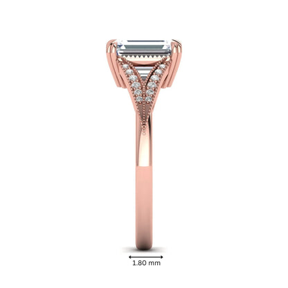 Emerald cut lab grown diamond engagement ring with round diamond split shank, milgrain detailing, and classic four prong setting in rose gold