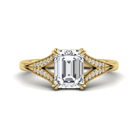 Emerald cut lab grown diamond engagement ring with round diamond split shank, milgrain detailing, and classic four prong setting in yellow gold