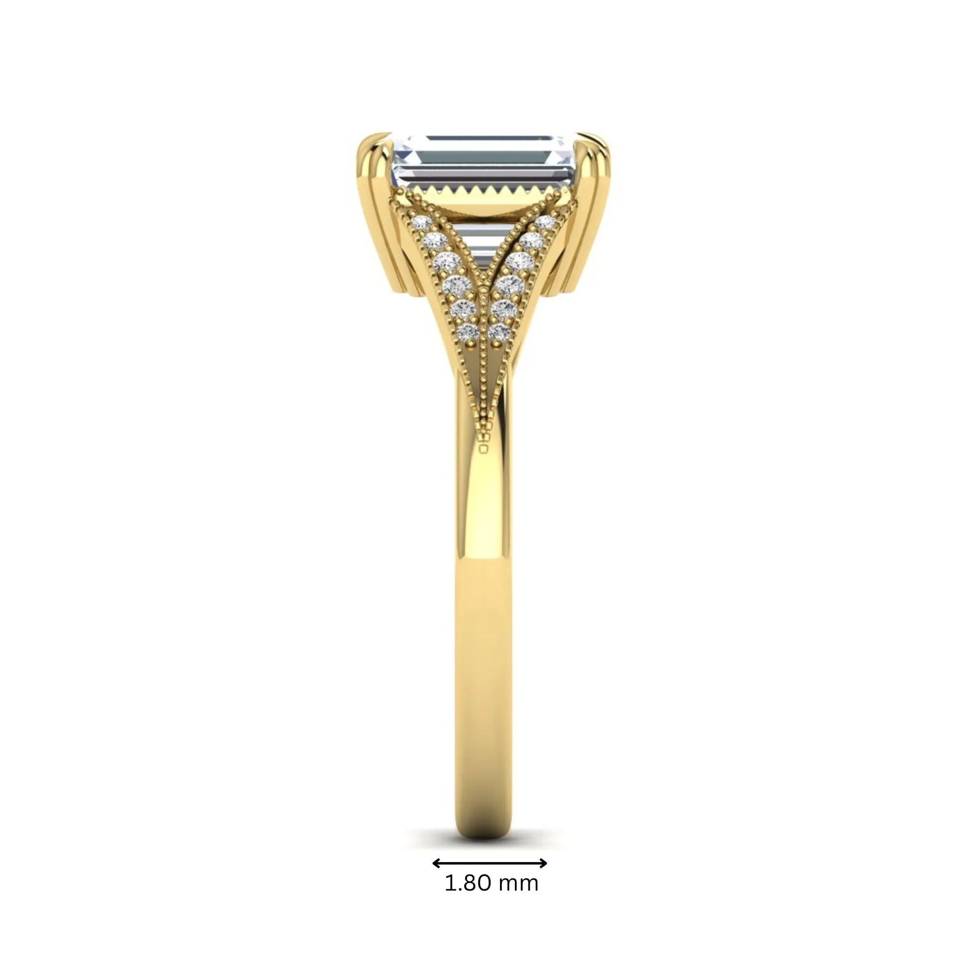 Emerald cut lab grown diamond engagement ring with round diamond split shank, milgrain detailing, and classic four prong setting in yellow gold
