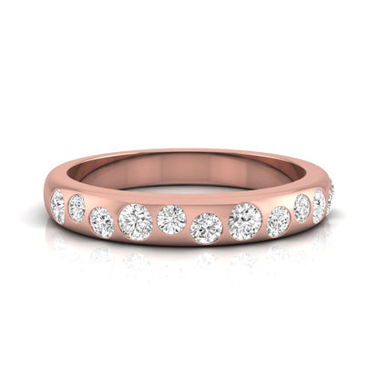 Flush set graduated round cut lab grown diamond band ring in polished rose gold with a modern half eternity design.