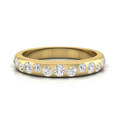 Flush set graduated round cut lab grown diamond band ring in polished yellow gold with a modern half eternity design.